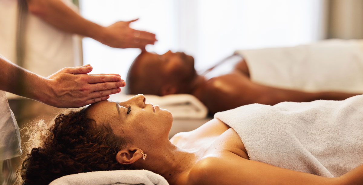 Couple getting massage at spa