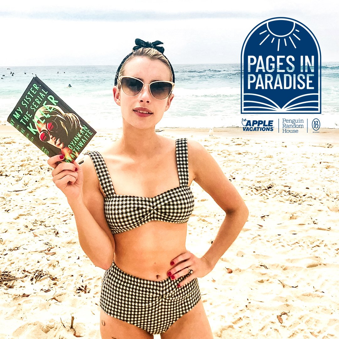 Emma Roberts at the beach with book in hand 